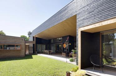 a house with a lawn and a patio