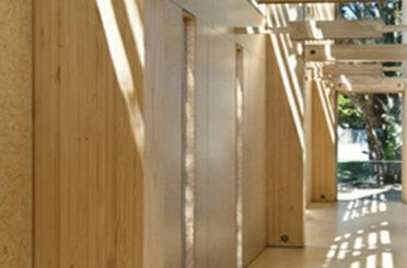 a wooden structure with a shadow on the ceiling