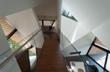 a staircase with glass railings